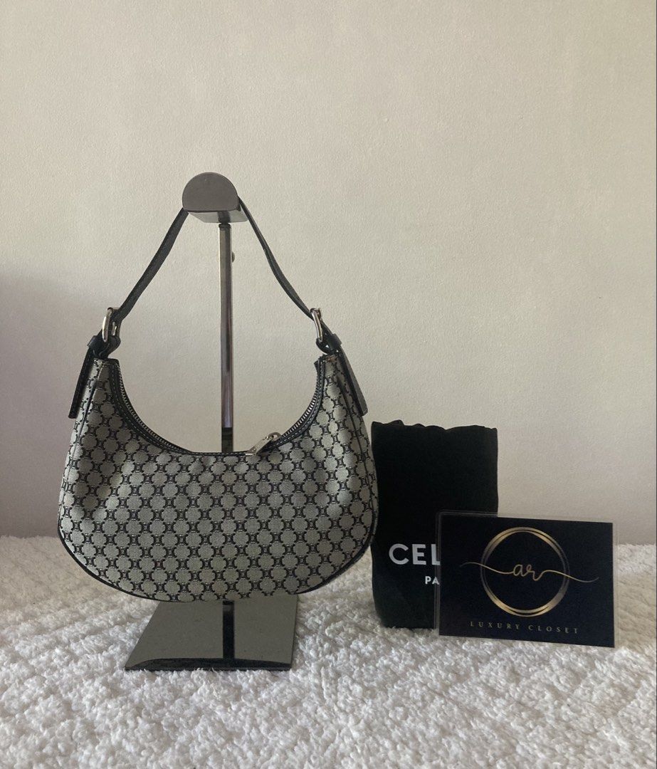 CELINE Macadam Hobo Canvas Shoulder Bag (Category: Luxury Bags & Wallets) located in Muntinlupa City. Submitted by arluxurycloset (Listing ID 1444827795, Image 3). Description: - Authentic Celine shoulder bag - Iconic Triomphe canvas pattern - Classic crescent shape - Leather trim and strap - Secure zipper closure - Stylish everyday bag - Comes with original dust bag 100% Authentic Preloved Luxury Brands Authenticity Money Back Guarantee CELINE A