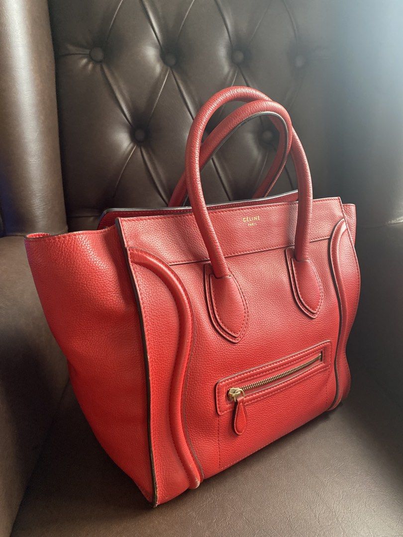 Celine Red Leather Luggage Tote Bag (Category: Luxury Bags & Wallets) located in Pasig City. Submitted by authentic_shopaholic_manila (Listing ID 1444708973, Image 2). Description: - Classic Celine Mini red leather tote - Iconic luggage design - Features a zippered front pocket - Comfortable top handles - Spacious interior for essentials - Timeless piece for any wardrobe - Ideal for daily use or special occasions Like us on FB: AUTHENTIC SHOPAHOL