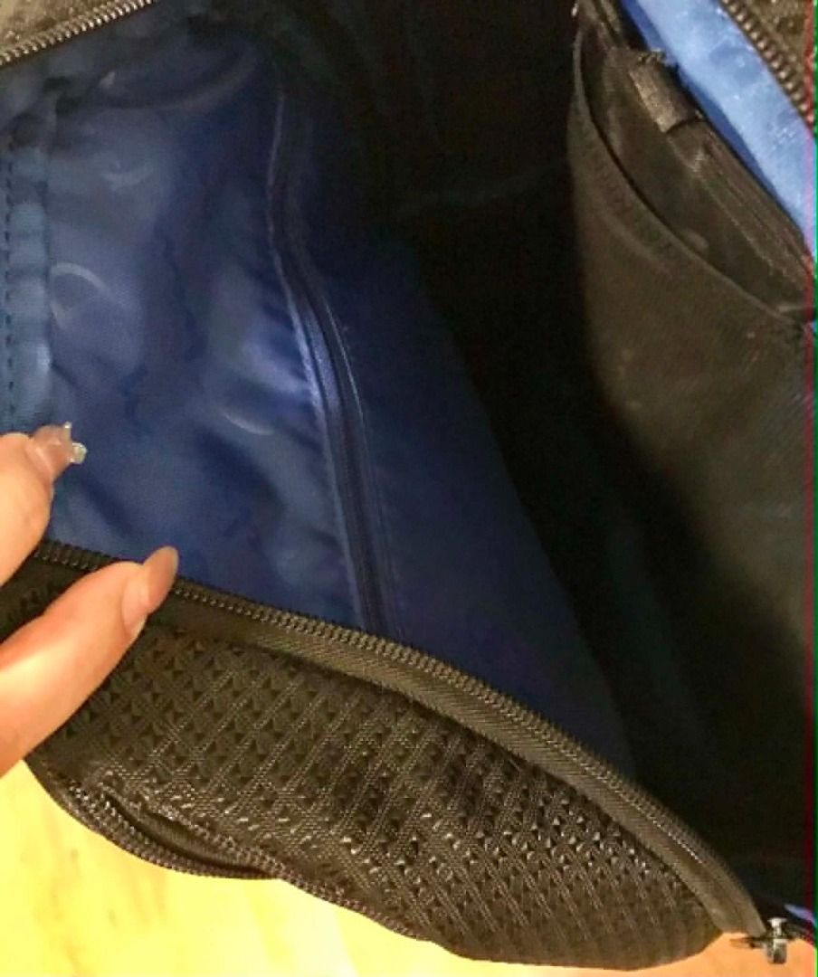 Champion Black Backpack with Blue Interior (Category: Backpacks) located in Manila. Submitted by nate2019 (Listing ID 1444778723, Image 2). Description: - Black Champion backpack - Bought in USA - Bright blue interior with repeated Champion logo - Multiple compartments for organization - Black zippers - Padded back and straps for comfort - Ideal for school or travel - Barely used. Proof is the bottom is without scratch or marks - Shows minimal si
