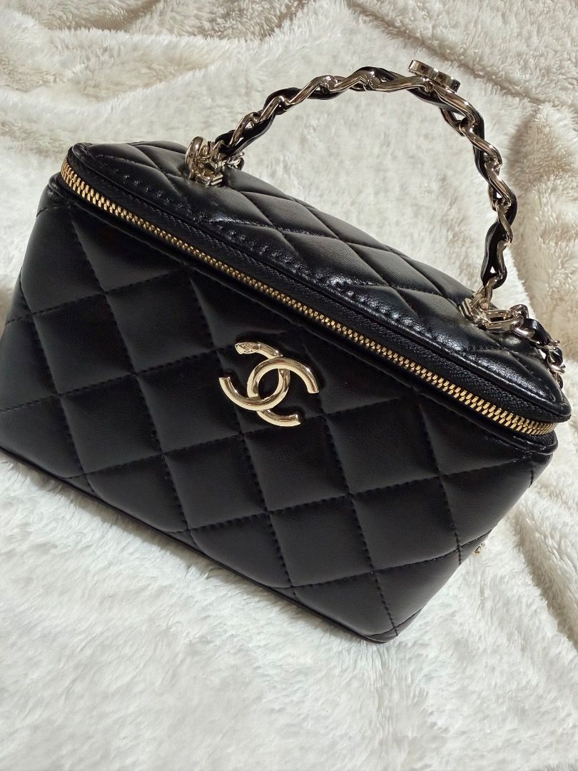 Chanel Black Quilted Vanity Case Bag (Category: Luxury Bags & Wallets) located in Cebu City. Submitted by luxury_revival_co_0525 (Listing ID 1444703572, Image 3). Description: - Classic Chanel black quilted vanity case - Gold hardware and chain strap - Zipper closure - Versatile: carry by top handle or wear as a crossbody - Ideal for carrying your essentials - Very chic and stylish.