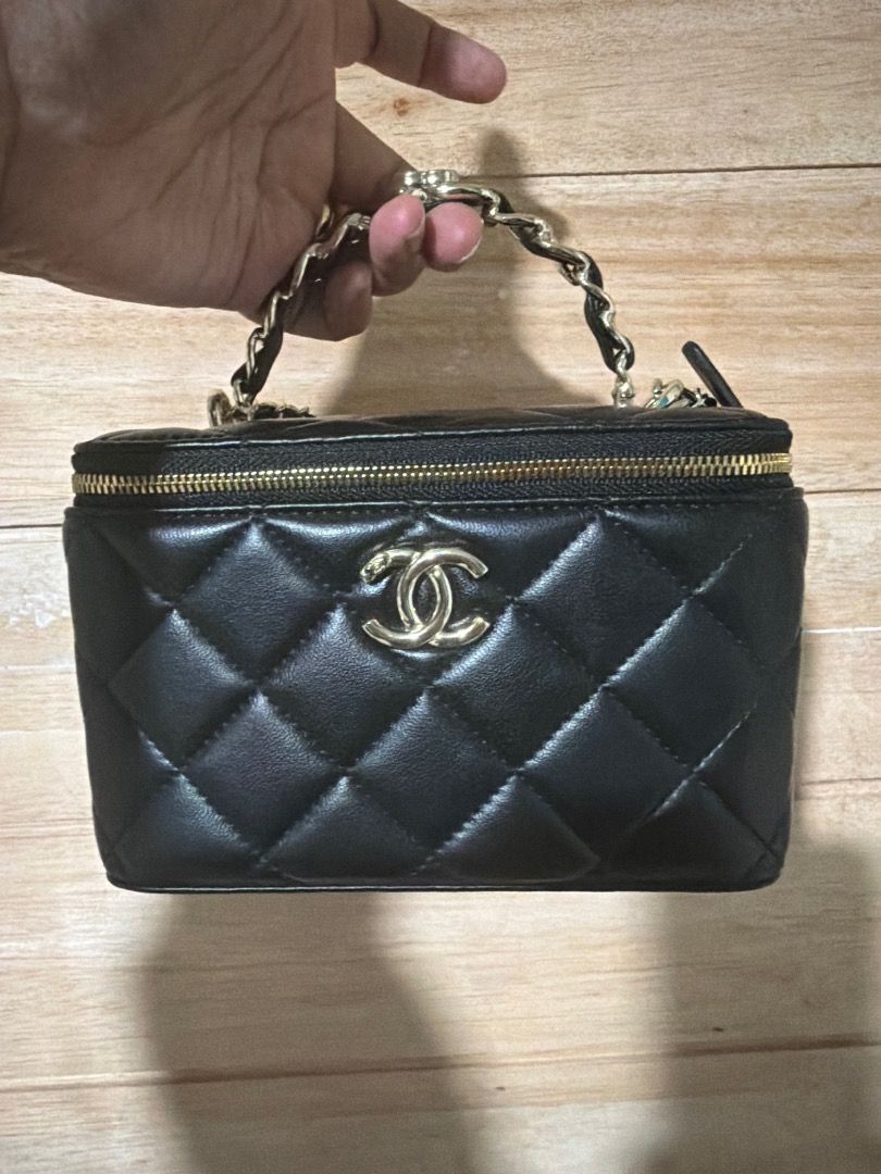 Chanel Black Quilted Vanity Case Bag (Category: Luxury Bags & Wallets) located in Cebu City. Submitted by luxury_revival_co_0525 (Listing ID 1444703572, Image 1). Description: - Classic Chanel black quilted vanity case - Gold hardware and chain strap - Zipper closure - Versatile: carry by top handle or wear as a crossbody - Ideal for carrying your essentials - Very chic and stylish.