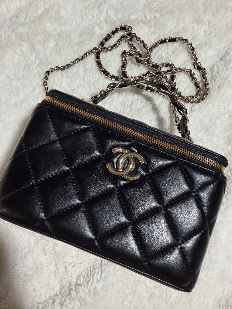Chanel Black Quilted Vanity Case Bag (Category: Luxury Bags & Wallets) located in Cebu City. Submitted by luxury_revival_co_0525 (Listing ID 1444703572, Image 2). Description: - Classic Chanel black quilted vanity case - Gold hardware and chain strap - Zipper closure - Versatile: carry by top handle or wear as a crossbody - Ideal for carrying your essentials - Very chic and stylish.