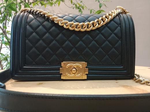 Chanel Boy Bag Black Lambskin Gold Hardware (Category: Luxury Bags & Wallets) located in Quezon City. Submitted by uybernice (Listing ID 1444852069, Image 3). Description: - Classic Chanel Boy Bag - Material: Black lambskin leather - Iconic diamond quilting - Signature gold CC turn-lock closure - Chunky gold chain strap - Includes original box, dust bag, and authenticity card - Timeless and elegant piece.