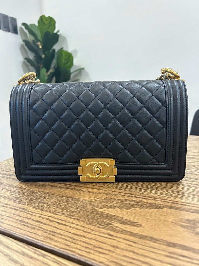 Chanel Boy Bag Black Lambskin Gold Hardware (Category: Luxury Bags & Wallets) located in Quezon City. Submitted by uybernice (Listing ID 1444852069, Image 1). Description: - Classic Chanel Boy Bag - Material: Black lambskin leather - Iconic diamond quilting - Signature gold CC turn-lock closure - Chunky gold chain strap - Includes original box, dust bag, and authenticity card - Timeless and elegant piece.