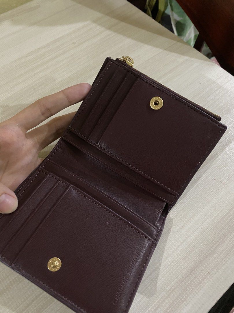 Charles & Keith Burgundy Geometric Tri-fold Wallet (Category: Wallets & Card holders) located in Quezon City. Submitted by xiaolongbaoluvrrr (Listing ID 1444742659, Image 3). Description: • rfs: i’ll buy a new wallet • bought last march • loc: fairview, qc.