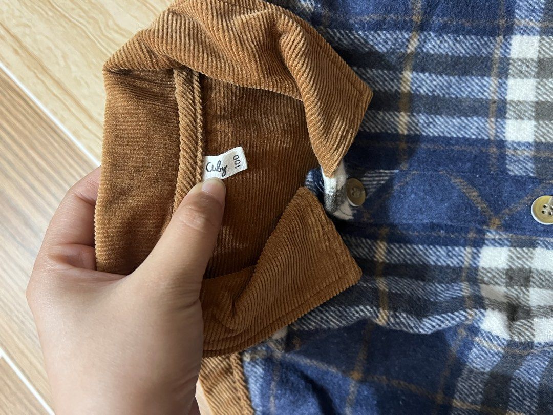 Children's Plaid Jacket with Corduroy Collar (Category: Coats, Jackets and Outerwear) located in Baguio. Submitted by izzy1234123 (Listing ID 1444764949, Image 3). Description: -for babies - Cute blue and white plaid jacket by Cuby - Size 100 - Features a stylish brown corduroy collar - Includes matching brown corduroy elbow patches - Easy button-up front - Two chest pockets - Warm and stylish for cooler weather - Great for everyday wear.