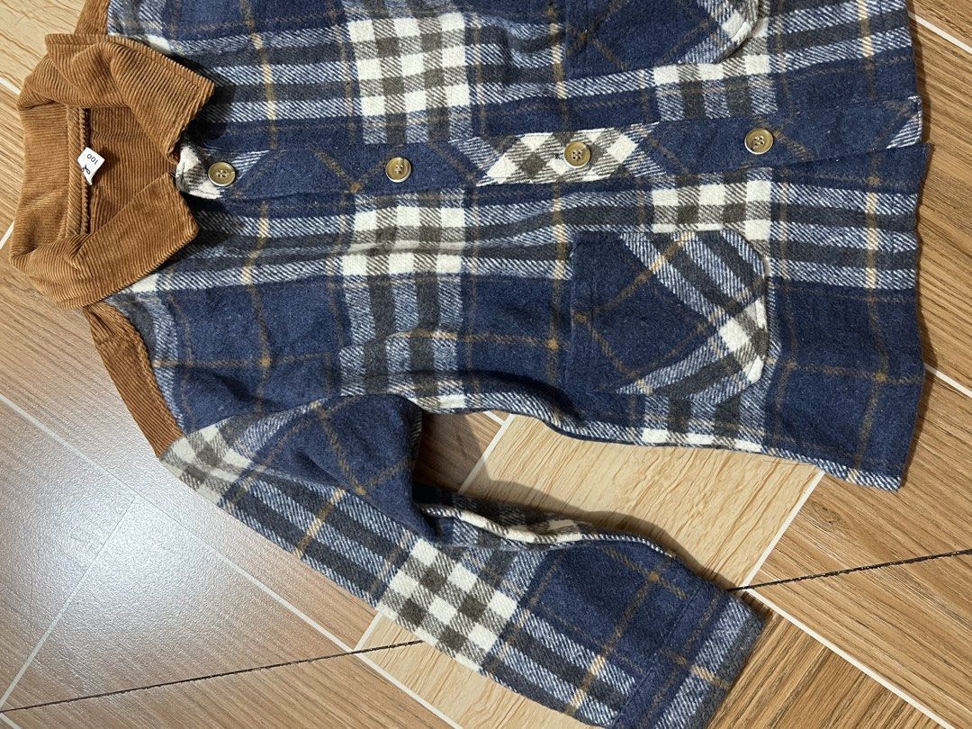 Children's Plaid Jacket with Corduroy Collar (Category: Coats, Jackets and Outerwear) located in Baguio. Submitted by izzy1234123 (Listing ID 1444764949, Image 2). Description: -for babies - Cute blue and white plaid jacket by Cuby - Size 100 - Features a stylish brown corduroy collar - Includes matching brown corduroy elbow patches - Easy button-up front - Two chest pockets - Warm and stylish for cooler weather - Great for everyday wear.