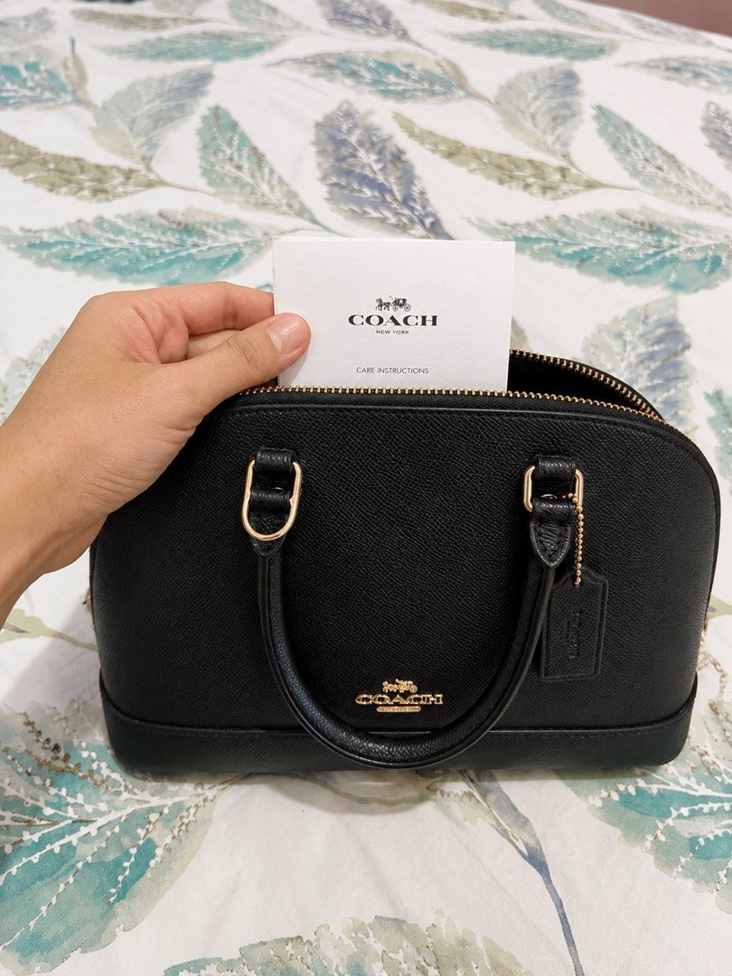 Authentic Coach Black Pebble Leather Dome Satchel Bag (Category: Luxury Bags & Wallets) located in Manila. Submitted by mellow_sunday111 (Listing ID 1444708084, Image 3). Description: - Authentic Black Coach Satchel Bag - Premium Pebble Leather Material - Elegant Gold Hardware Details - Versatile Top Handles & Detachable Crossbody Strap - Includes Original Care Instructions Card - Ideal for Everyday Use or Special Occasions.