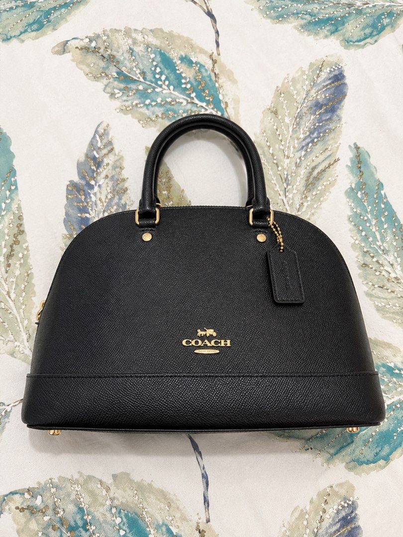 Authentic Coach Black Pebble Leather Dome Satchel Bag (Category: Luxury Bags & Wallets) located in Manila. Submitted by mellow_sunday111 (Listing ID 1444708084, Image 1). Description: - Authentic Black Coach Satchel Bag - Premium Pebble Leather Material - Elegant Gold Hardware Details - Versatile Top Handles & Detachable Crossbody Strap - Includes Original Care Instructions Card - Ideal for Everyday Use or Special Occasions.
