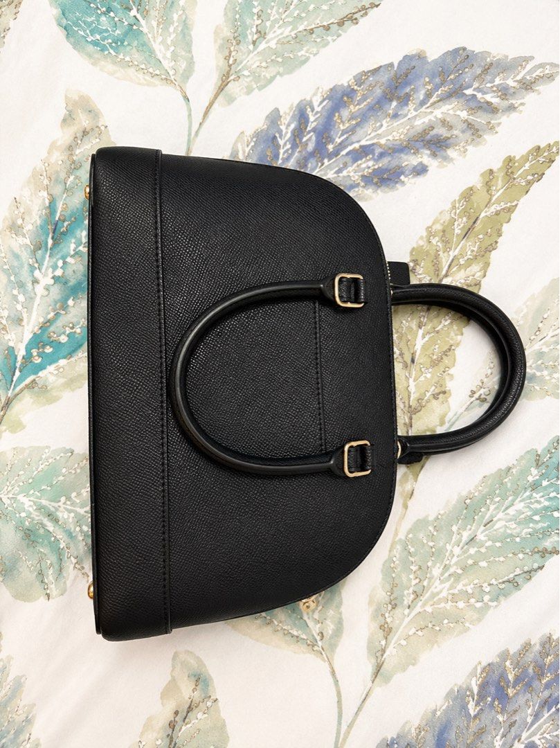 Authentic Coach Black Pebble Leather Dome Satchel Bag (Category: Luxury Bags & Wallets) located in Manila. Submitted by mellow_sunday111 (Listing ID 1444708084, Image 2). Description: - Authentic Black Coach Satchel Bag - Premium Pebble Leather Material - Elegant Gold Hardware Details - Versatile Top Handles & Detachable Crossbody Strap - Includes Original Care Instructions Card - Ideal for Everyday Use or Special Occasions.