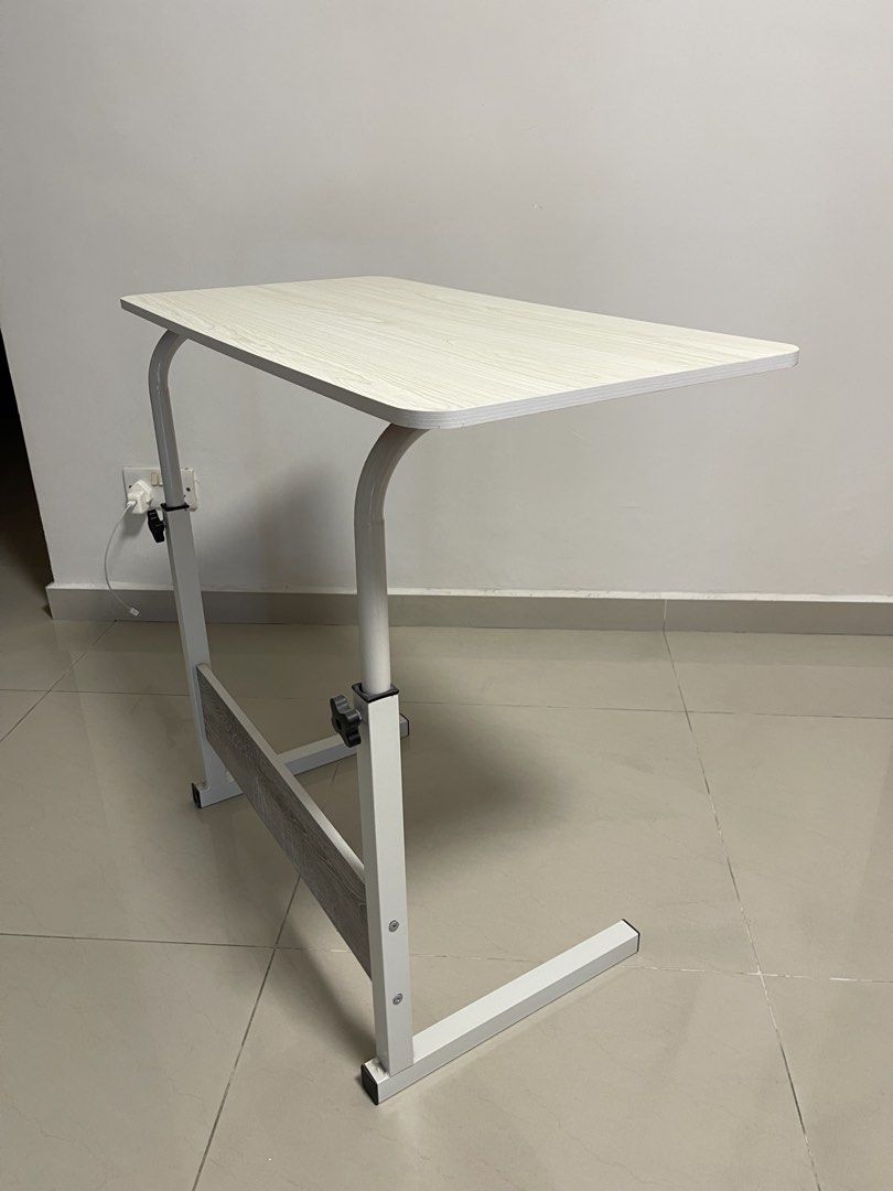 Computer table and Side table (Category: Tables & Sets) located in Singapore. Submitted by reignsfinn (Listing ID 1444758157, Image 2). Description: Bedside or Computer table, portable with adjustable height. .