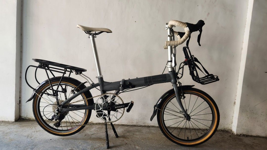 Dahon Mariner D8 (Category: Bicycles) located in Binan City. Submitted by leviticus78 (Listing ID 1444682357, Image 3). Description: - Grey folding bike - Equipped with rear rack and front basket The Dahon Mariner D8 is widely considered one of the best "bang for your buck" 20-inch folding bikes on the market. Known for its corrosion-resistant frame and commuter-ready accessories, it bridges the gap perfectly between a highly portable commuter an