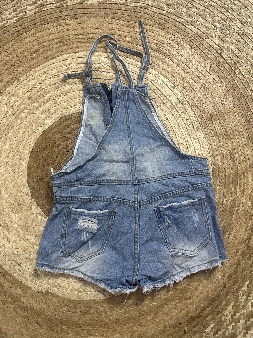 Denim Overalls with Patch - Size 26 (Category: Jumpsuits) located in Tarlac. Submitted by relovedph_02 (Listing ID 1444745108, Image 2). Description: - Adorable denim overalls with a cute front patch. - Trendy distressed details on the shorts. - Adjustable straps for a perfect fit. - Easy zipper closure. - Made from comfortable 100% cotton. - Ideal for everyday casual outfits..