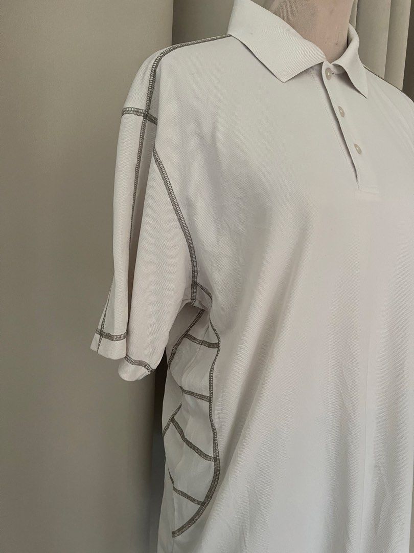 Destinations Global beige (Category: Tshirts & Polo Shirts ) located in Cainta. Submitted by zlove111 (Listing ID 1444699575, Image 3). Description: - White polo shirt from Destinations Global - Size L- XL 23x29 - Features contrast stitching on sleeves and sides - Button-up neckline - Made in Malaysia - Ideal for casual wear or golf.