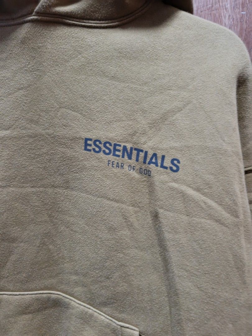 Fear of God Essentials Hoodie - Khaki (Category: Hoodies) located in Manila. Submitted by jes123. (Listing ID 1444683956, Image 3). Description: - Authentic Fear of God Essentials Khaki Hoodie - Classic Essentials logo on chest - Large embossed logo on the back - Convenient kangaroo pocket - Comfortable and stylish for everyday wear.