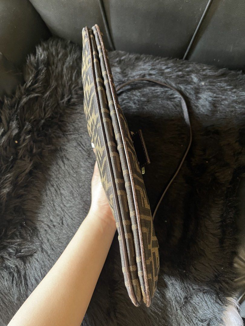 Fendi Zucca Double Flap Canvas Baguette Bag (Category: Luxury Bags & Wallets) located in Davao. Submitted by boodle4lyf (Listing ID 1444768496, Image 3). Description: Authentic or moneyback Fendi Baguette bag with iconic Zucca print. Brown/beige canvas with leather trim and silver buckle. Single shoulder strap. Has signs of wear in the corners but can be retouched as no major damages such as open pipings. Buckle has scratches as well..