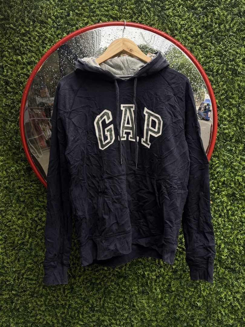 GAP Navy Blue Hoodie Size M (Category: Hoodies) located in Bacolod City. Submitted by Ms_OnlineBoutiqe (Listing ID 1444719369, Image 2). Description: - Classic navy blue GAP hoodie -width 20 and a half -length 25 - Features iconic GAP logo across the chest - Made from comfortable material - Perfect for casual wear - Size: Medium - Please check photos for detailed condition.