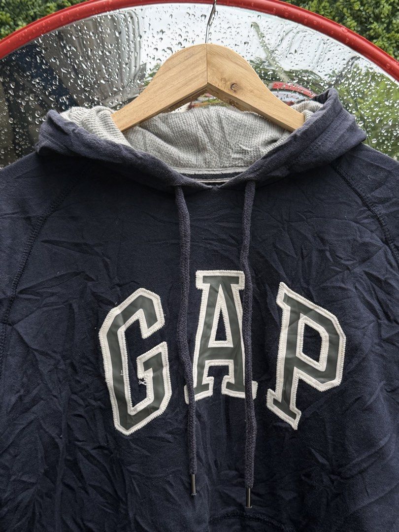 GAP Navy Blue Hoodie Size M (Category: Hoodies) located in Bacolod City. Submitted by Ms_OnlineBoutiqe (Listing ID 1444719369, Image 1). Description: - Classic navy blue GAP hoodie -width 20 and a half -length 25 - Features iconic GAP logo across the chest - Made from comfortable material - Perfect for casual wear - Size: Medium - Please check photos for detailed condition.