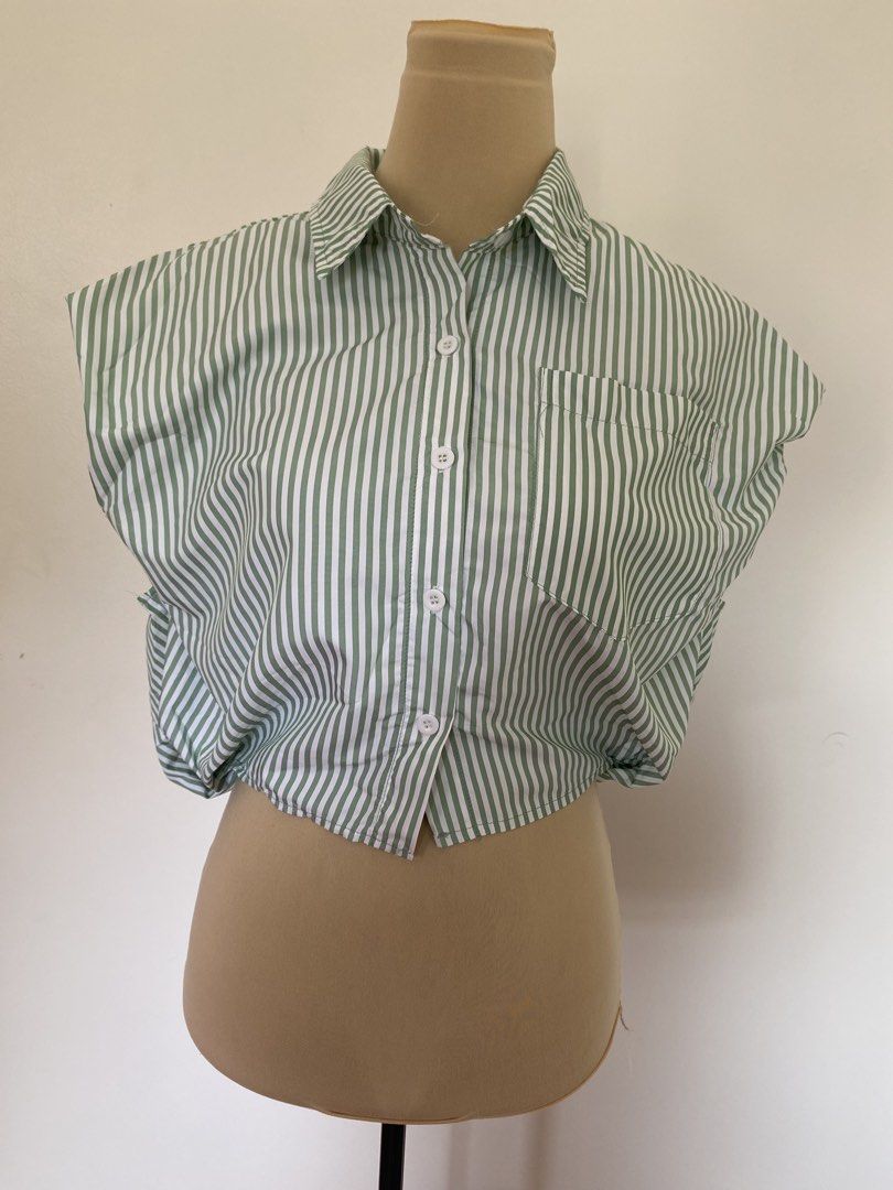 Green and White Striped Cropped Button-Up Shirt (Category: Shirts) located in Santa Rosa. Submitted by summerbrunch (Listing ID 1444856259, Image 1). Description: BUY WORTH 1K, GET FREE SHIPPING! EXCEPT FOR STROLLER BAG MANNEQUIN SIZE: Medium Has garterize back Never worn - Cute green and white striped cropped shirt - Button-up front with a collar - Short cap sleeves with gathered detail - Elasticated hem - Pairs well with high-waisted bottoms - 