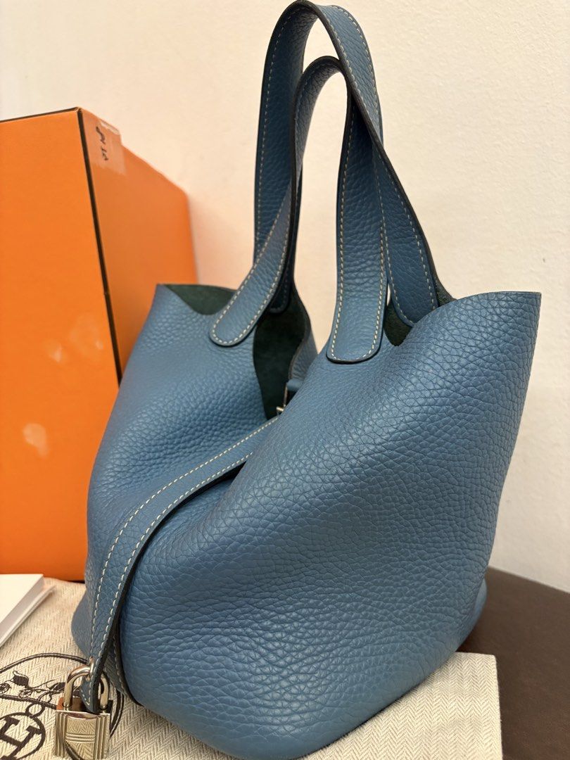 Hermes Blue Leather Picotin 18 Lock Bag (Category: Luxury Bags & Wallets) located in Pasig City. Submitted by authentic_shopaholic_manila (Listing ID 1444709695, Image 2). Description: - Authentic Hermes Picotin 18 Lock bag - Stunning blue pebbled leather - Comes with original lock and keys - Includes original box, dust bag, and care booklet, lock (missing key) and Entrupy -stamp T 2015 - Ideal everyday bag Like us on FB: AUTHENTIC SHOPAHOLIC MAN