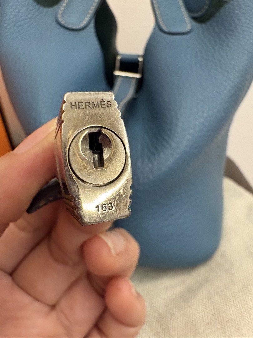 Hermes Blue Leather Picotin 18 Lock Bag (Category: Luxury Bags & Wallets) located in Pasig City. Submitted by authentic_shopaholic_manila (Listing ID 1444709695, Image 3). Description: - Authentic Hermes Picotin 18 Lock bag - Stunning blue pebbled leather - Comes with original lock and keys - Includes original box, dust bag, and care booklet, lock (missing key) and Entrupy -stamp T 2015 - Ideal everyday bag Like us on FB: AUTHENTIC SHOPAHOLIC MAN