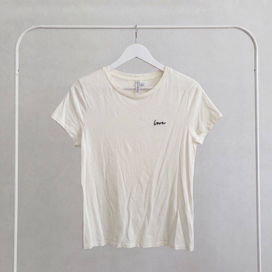 H&M Divided White 'Love' T-shirt (Category: Shirts) located in Los Banos. Submitted by jellybeeeans (Listing ID 1444734525, Image 2). Description: fits up to large body frame NWOT.