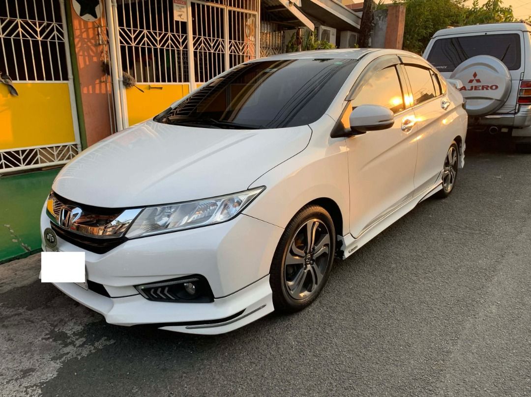 Honda City 1.5-VTEC VX+ NAVI Auto (Category: Used Cars) located in Quezon City. Submitted by gggmmae (Listing ID 1444791559, Image 1). Description: >67,000 km mileage >Color: WHITE >All original paint >VX+ Navi = Paddle shifters, built-in navigation, all digital controls >Orig leather seats, wheel mags, & back to orig new Bridgestone tires >2nd owner (24,732 km mileage from 1st owner when acquired Feb 2019) >Updated reg >Amaron battery/retained o