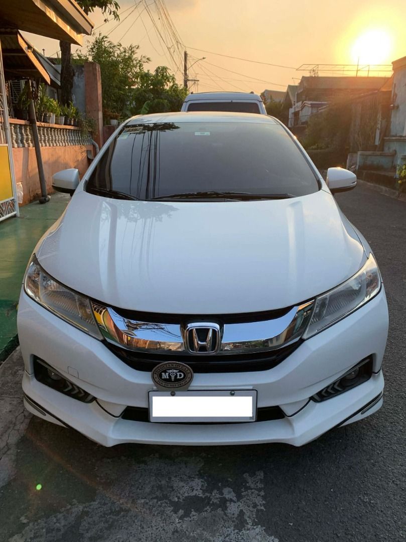 Honda City 1.5-VTEC VX+ NAVI Auto (Category: Used Cars) located in Quezon City. Submitted by gggmmae (Listing ID 1444791559, Image 3). Description: >67,000 km mileage >Color: WHITE >All original paint >VX+ Navi = Paddle shifters, built-in navigation, all digital controls >Orig leather seats, wheel mags, & back to orig new Bridgestone tires >2nd owner (24,732 km mileage from 1st owner when acquired Feb 2019) >Updated reg >Amaron battery/retained o