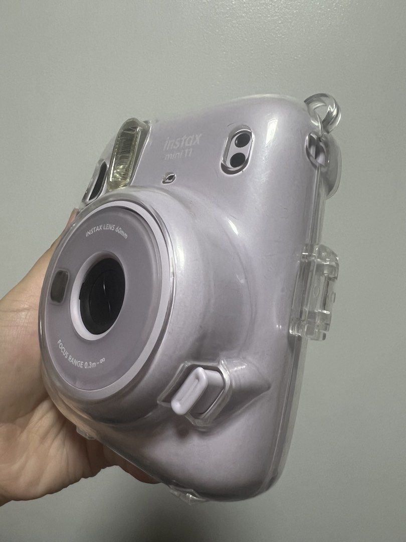 INSTAX MINI 11 LILAC (Category: Cameras) located in Manila. Submitted by brightflower-7629 (Listing ID 1444850242, Image 3). Description: Selling my Instax Mini 11 Lilac Comes with the clear hard case and fresh batteries. No issues with the item, and still works in perfect condition. Has 7 films inside !! Price is negotiable! RFS: Upgrading to 13.