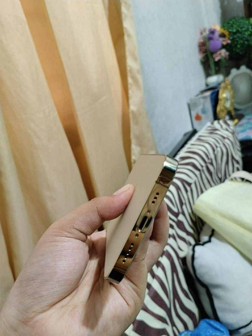 Iphone 12 PRO 128GB (Category: iPhone 12 Series) located in Marikina City. Submitted by raphreyes (Listing ID 1444799555, Image 2). Description: FOR SALE ONLY, PASS SA SWAP UNIT ONLY Quick Specs & Features: •Storage: 128GB •Battery Health: 100% 🔋 •Network: Factory Unlocked / Openline to all •networks •Color: Gold Features: 5G capable, Pro camera system with LiDAR scanner, cinematic video recording, and a beautiful Super Retina XDR display..