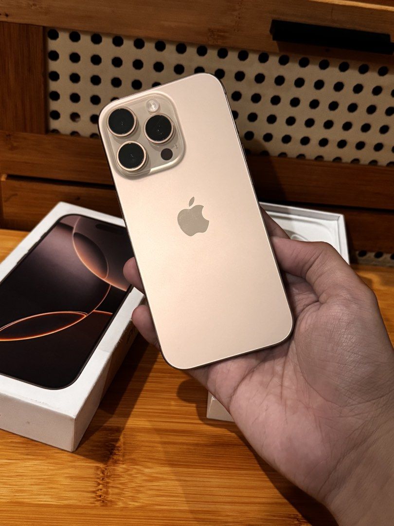 iPhone 16 Pro | Desert Titanium | Smartlocked (Category: iPhone 16 Series) located in Dasmarinas. Submitted by smsebtian (Listing ID 1444699677, Image 3). Description: iPhone 16 Pro - (128GB) Desert Titanium 89% Battery Health. Under warranty till July 9, 2026. Comes with Original Cord and Box. Smartlocked. With some minor dents, but overall the phone is highly presentable. Good condition. Open for swap to iPhone 15 Pro | 15 Pro Max or any offers