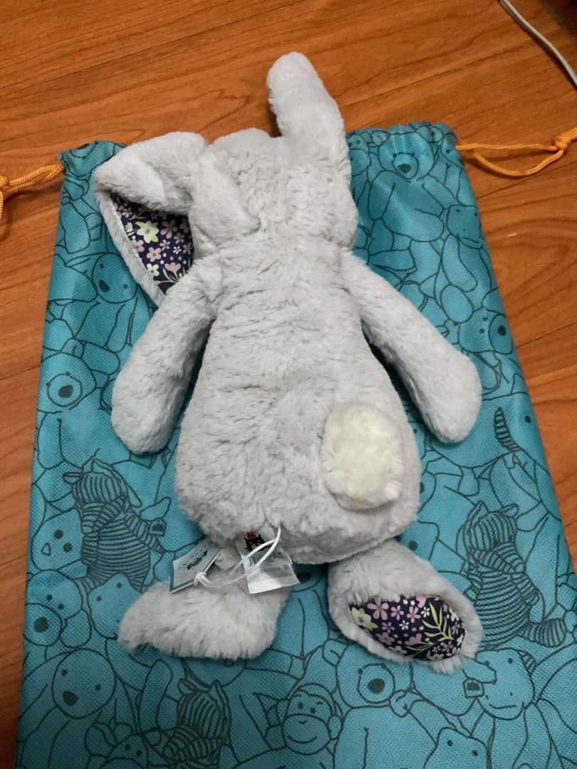 Jellycat Grey Bunny Plush Toy with Drawstring Bag (Category: Plushies & Soft Toys) located in Cavite. Submitted by dridridridiri (Listing ID 1444802828, Image 1). Description: - Super soft ORIGINAL Jellycat bunny - Includes original drawstring bag with animal print and Jellycat logo - Bunny has floral print inside ears and on paws - Ideal for gifting or collecting.