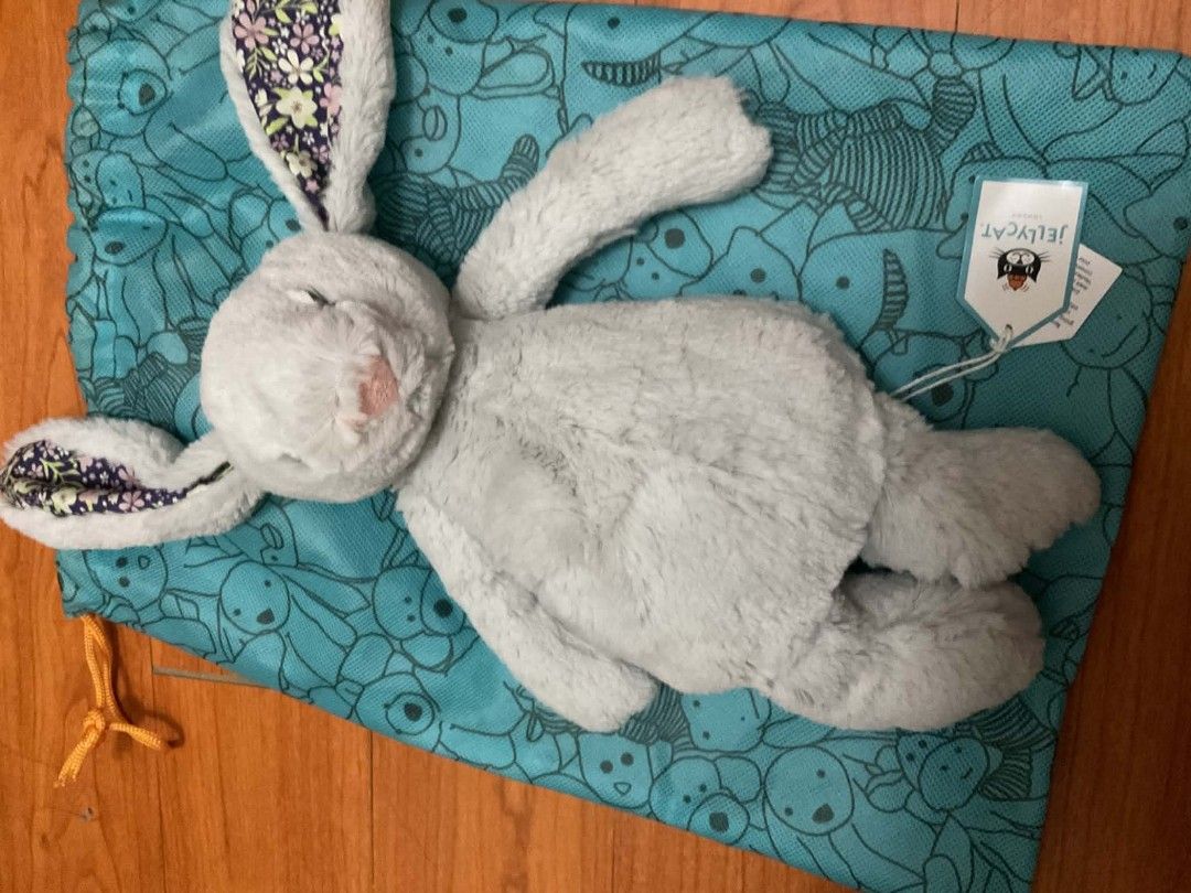 Jellycat Grey Bunny Plush Toy with Drawstring Bag (Category: Plushies & Soft Toys) located in Cavite. Submitted by dridridridiri (Listing ID 1444802828, Image 3). Description: - Super soft ORIGINAL Jellycat bunny - Includes original drawstring bag with animal print and Jellycat logo - Bunny has floral print inside ears and on paws - Ideal for gifting or collecting.