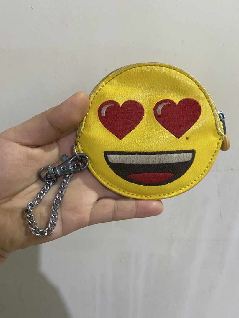 Kipling Emoji Yellow Coin Pouch with Chain (Category: Purses & Pouches) located in General Santos City (Dadiangas). Submitted by mylhing88 (Listing ID 1444794688, Image 2). Description: - Cute yellow Kipling coin pouch - Features 'emoji' design - Comes with a metal chain - Small and round shape - Ideal for coins or small essentials - Shows some signs of wear, still functional.