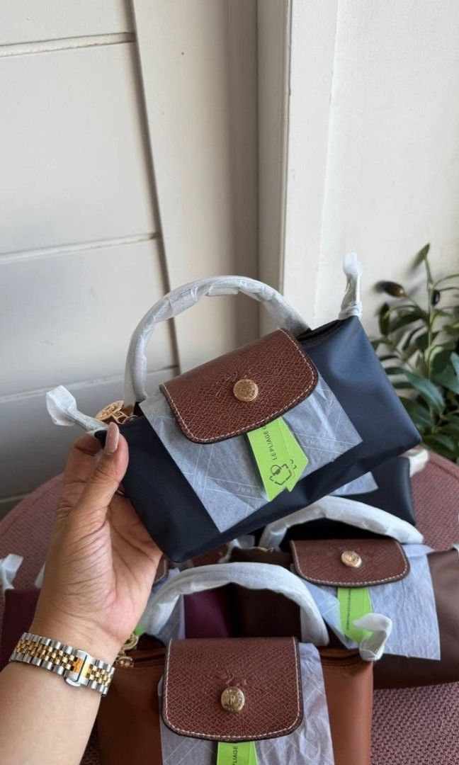 Long Champ Le Pliage Mini (Category: Luxury Bags & Wallets) located in Antipolo. Submitted by brigeshop01 (Listing ID 1437596627, Image 2). Description: bnew complete inclusions limited stocks available in Navy Blue💙 w/ strap.