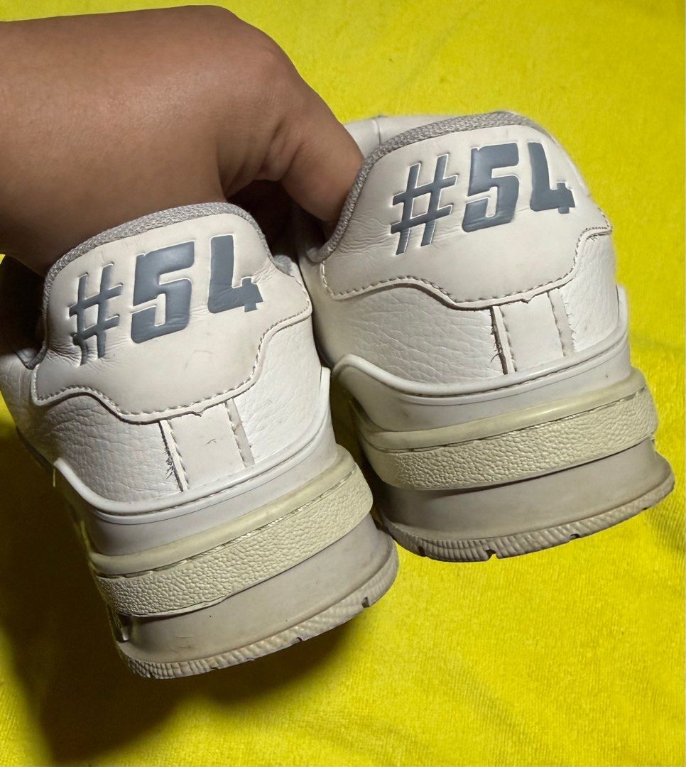 Louis Vuitton LV Trainer "#54" Sneakers White (Category: Sneakers & Footwear) located in Taytay. Submitted by jayezapanta (Listing ID 1444853407, Image 2). Description: - Authentic Louis Vuitton white sneakers - Features iconic LV logo on the tongue - "Louis Vuitton" script detailing on the side - Unique "#54" detail on the heel - "Louis Vuitton" name embossed on the soles - Stylish and eye-catching design 6.5 on tag 25cm insole Changed insole na