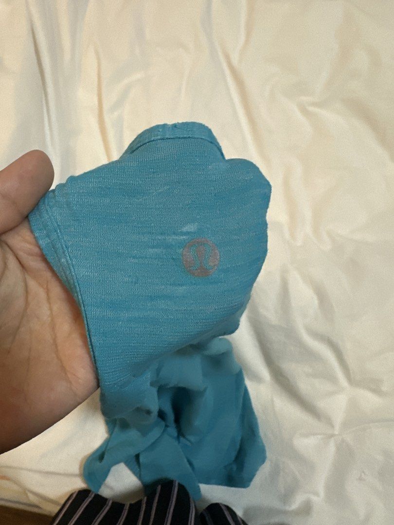 Lululemon Teal Racerback Tank Top (Category: Activewear) located in Plaridel. Submitted by juliaco08 (Listing ID 1444724947, Image 3). Description: - Teal Lululemon tank top - Racerback style with a split back detail - Lightweight and breathable fabric - Ideal for workouts or casual wear - Lululemon logo visible on the back.