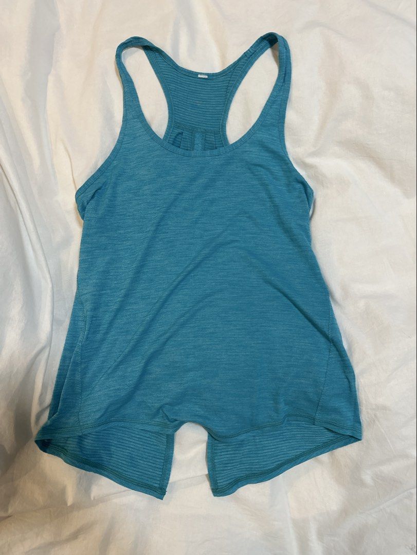 Lululemon Teal Racerback Tank Top (Category: Activewear) located in Plaridel. Submitted by juliaco08 (Listing ID 1444724947, Image 1). Description: - Teal Lululemon tank top - Racerback style with a split back detail - Lightweight and breathable fabric - Ideal for workouts or casual wear - Lululemon logo visible on the back.