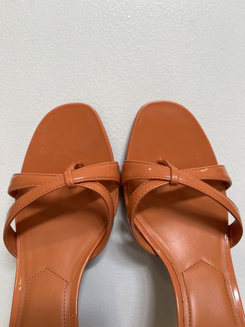 MANGO Orange Square Toe Mule Sandals with Thin Straps Kitten Heel (Category: Heels) located in Muntinlupa City. Submitted by boo_thingthings (Listing ID 1444771455, Image 2). Description: Brand: MANGO • Size: US 7 • Color: Vibrant orange • Features: Glossy patent finish, square toe, strappy design, low kitten heel • Condition: Excellent condition (see photos) – comes with original MANGO box • Style: Chic summer heels perfect for casual or dressed