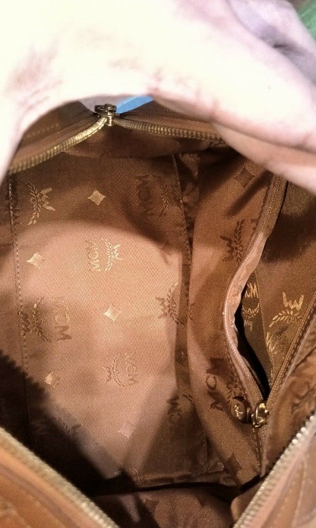MCM Cognac Boston 26cm (Category: Luxury Bags & Wallets) located in Quezon City. Submitted by 88bagelya_ni_rhen88 (Listing ID 1437736332, Image 3). Description: - Authentic MCM handbag - Brown color with MCM logo print - Front pocket - Gold-tone hardware - Includes top handles and charm - Stylish and functional for everyday use - 26cm -like new condition - preloved from japan 🇯🇵.