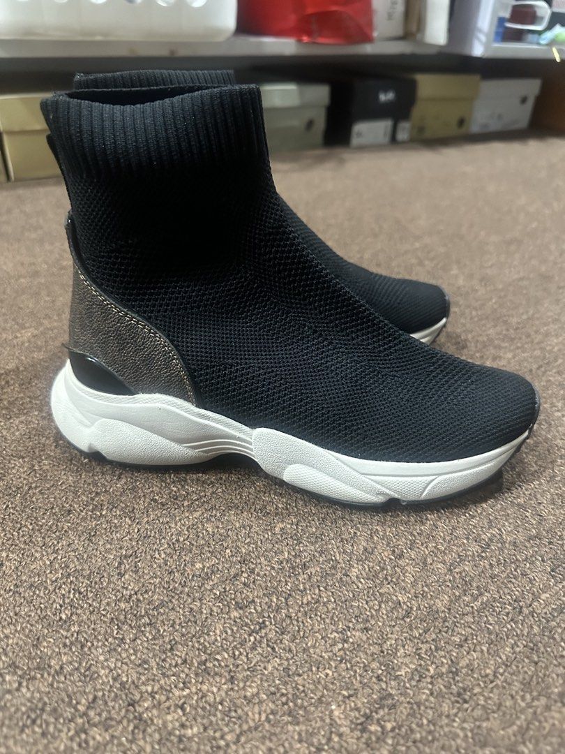 Michael Kors MK Sock Sneakers Black White (Category: Sneakers) located in Quezon City. Submitted by shop.marga (Listing ID 1444794236, Image 1). Description: - Stylish black sock sneakers - Comfortable knit upper - White soles - MK logo pattern on the back heel - Easy slip-on and off design - Perfect for everyday wear - Slightly used with care - Size 6.5 RFS: Have Balenciaga Speed Trainer.