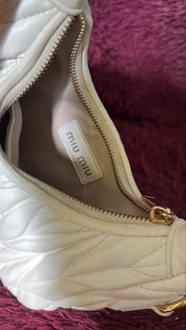 Miu Miu White Quilted Leather Hobo Bag (Category: Luxury Bags & Wallets) located in Muntinlupa City. Submitted by armendaber03743 (Listing ID 1444804913, Image 2). Description: -Miu Miu hobo bag in classic white. - Luxurious quilted leather with elegant gold hardware. - Secure zipper closure for your belongings. - Ideal everyday bag, perfectly sized for essentials..