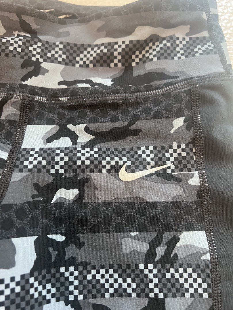 Nike Dri-Fit Camo Leggings (Category: Activewear) located in Makati City. Submitted by nicole_7 (Listing ID 1444754745, Image 2). Description: - Nike Dri-Fit running leggings - Stylish cool grey camouflage and checkerboard pattern - Flattering side panels for a sleek silhouette - Waistband tie - Versatile for workouts or everyday casual wear.
