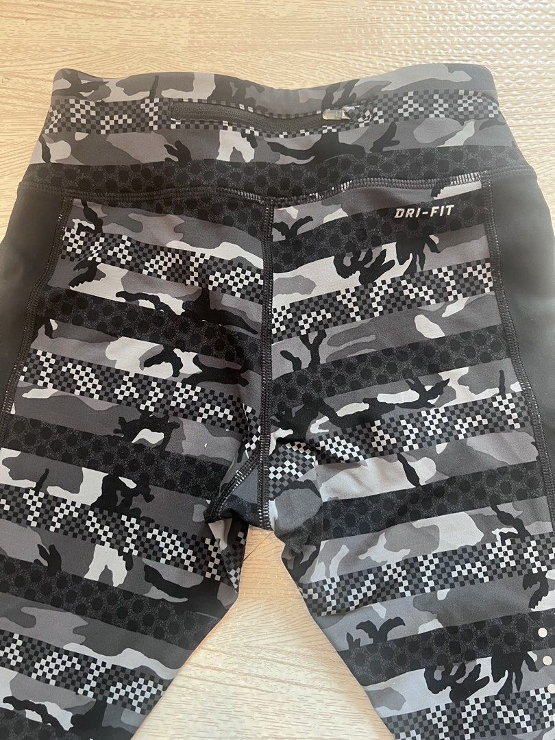 Nike Dri-Fit Camo Leggings (Category: Activewear) located in Makati City. Submitted by nicole_7 (Listing ID 1444754745, Image 3). Description: - Nike Dri-Fit running leggings - Stylish cool grey camouflage and checkerboard pattern - Flattering side panels for a sleek silhouette - Waistband tie - Versatile for workouts or everyday casual wear.