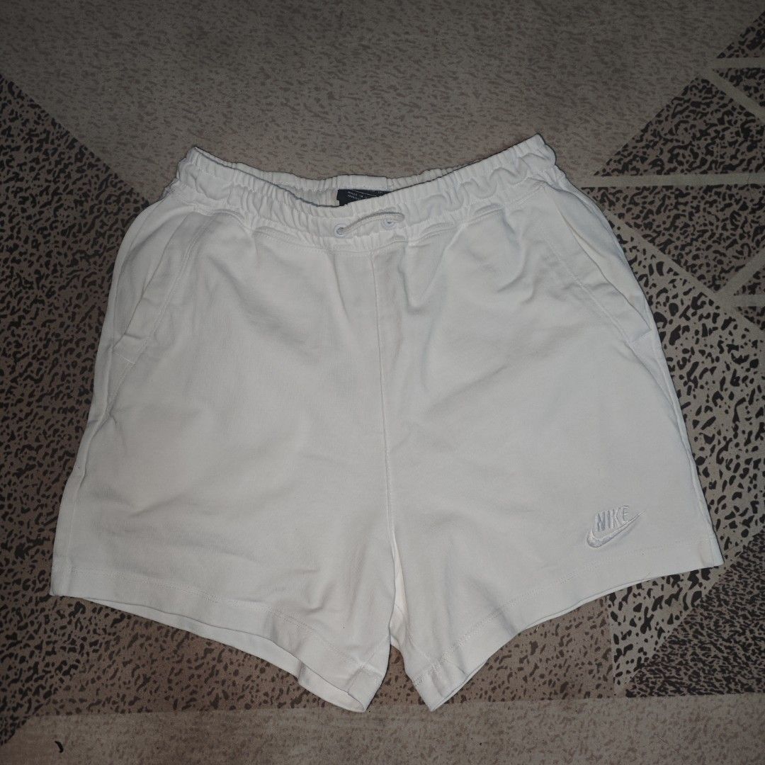 Nike Sportswear White Shorts (Category: Shorts) located in Tanay. Submitted by polothriftedit (Listing ID 1444729479, Image 1). Description: No issue Excellent condition Color rate: 10/10 No loose stitches, no distressing xs on tag dimes: waist: 24"-28" total length: 14.5" leg opening: 11" [ pwede tumawad kahit walang kasalanan ] no return, no exchange, no refund.