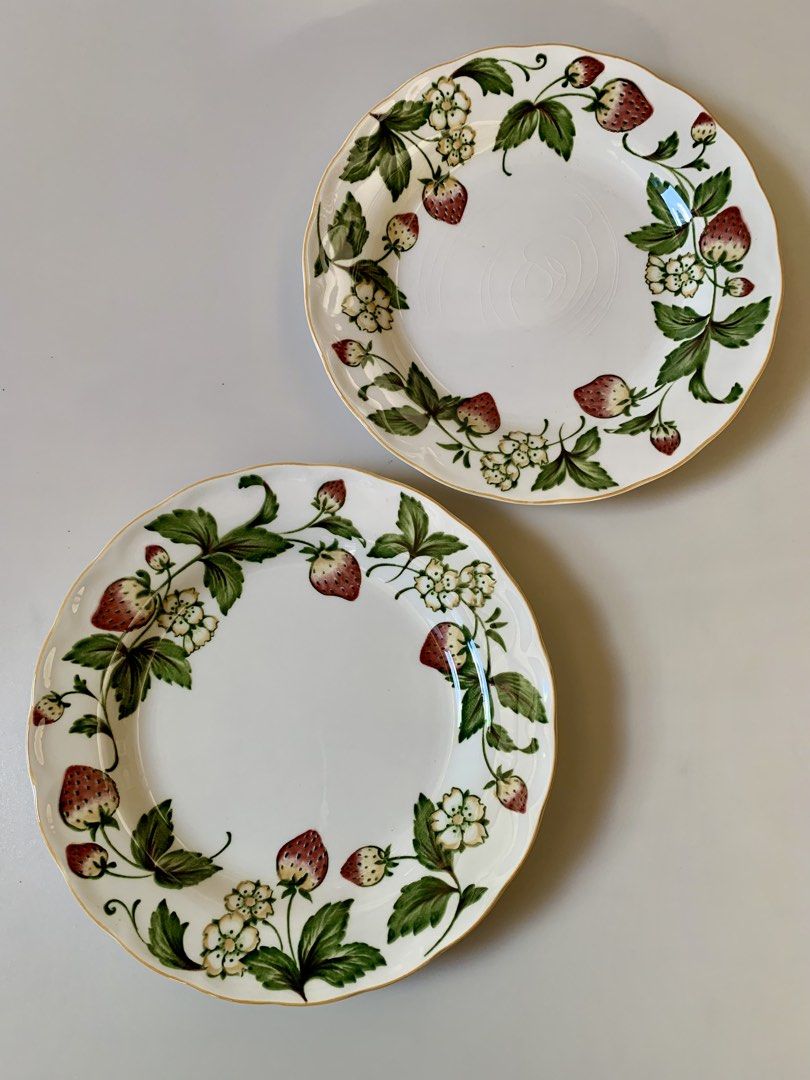 Nikko Spring Valley Casual Living collection Bread Plate (Category: Dinnerware & Cutlery) located in Tandag. Submitted by jeason_22 (Listing ID 1444707849, Image 3). Description: These plates are from the Nikko Spring Valley Casual Living collection, featuring a white porcelain body decorated with a vibrant strawberry and flower vine pattern and a gold-trimmed, scalloped edge. * 7.5 inches in diameter * Brand: Nikko * Pattern: Spring Valley * Mat