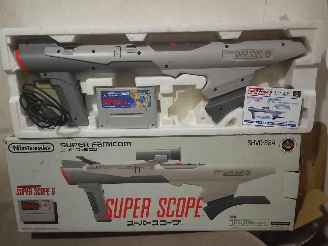 Nintendo Super Famicom Super Scope 6 Light Gun Set (Category: Nintendo) located in Manila. Submitted by herbertantazo (Listing ID 1444797068, Image 1). Description: sampaloc manila Super Famicom Super Scope 6 set - Includes Super Scope 6 gun - Includes Super Scope 6 game cartridge - Original box included issue missing scope attachment selling as is 2000 pesos .