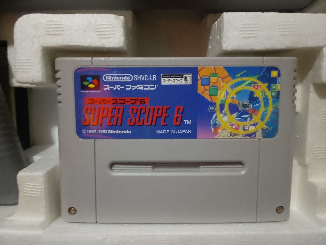 Nintendo Super Famicom Super Scope 6 Light Gun Set (Category: Nintendo) located in Manila. Submitted by herbertantazo (Listing ID 1444797068, Image 2). Description: sampaloc manila Super Famicom Super Scope 6 set - Includes Super Scope 6 gun - Includes Super Scope 6 game cartridge - Original box included issue missing scope attachment selling as is 2000 pesos .