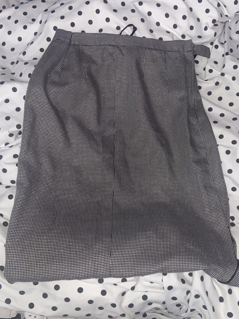 Office Skirt Black and White (Category: Other Bottoms) located in Marikina City. Submitted by scarkiv (Listing ID 1444843804, Image 1). Description: - Classic houndstooth pattern pants - Versatile for dress or work occasions - Features a subtle fabric texture - Small dark mark present on the front near the top - Waistband includes a side tab detail.