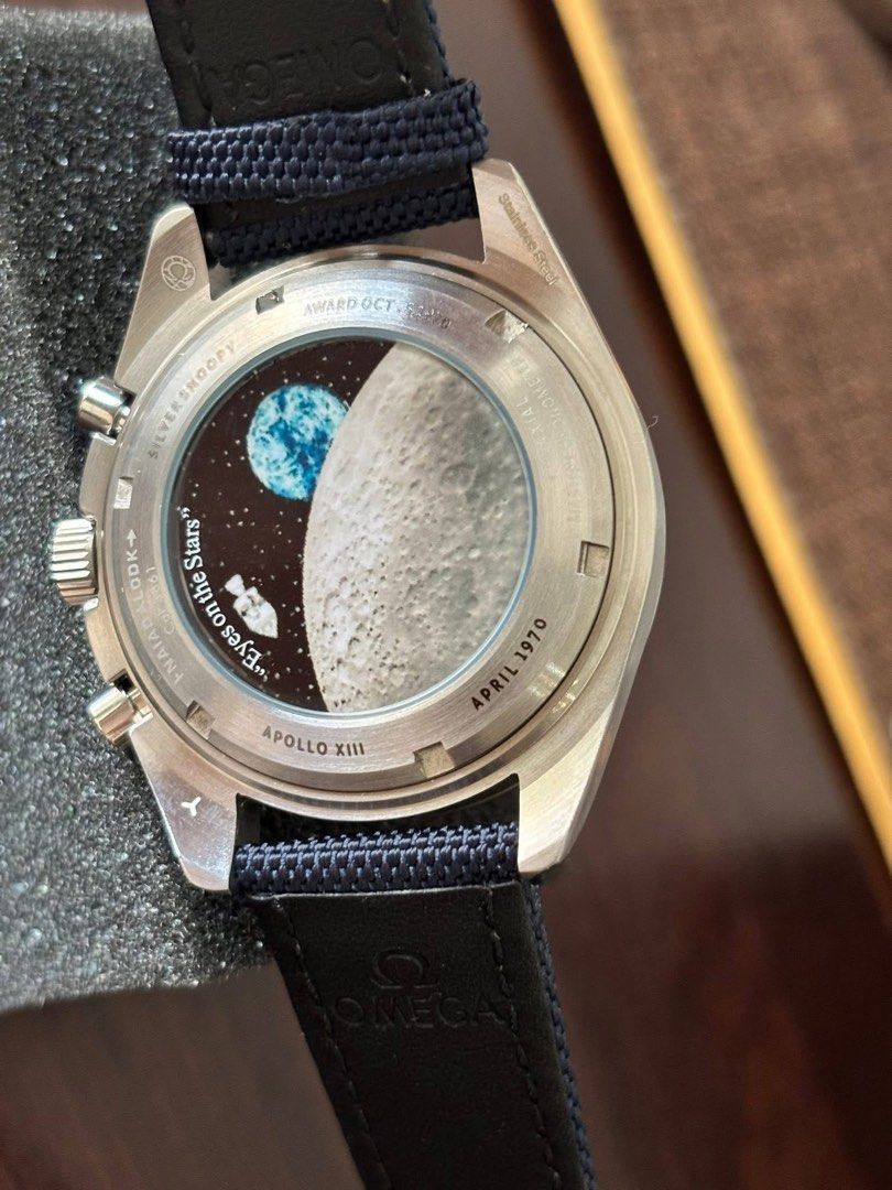Omega Speedmaster Professional Snoopy Award Watch (Category: Luxury Watches) located in Manila. Submitted by zhen_09 (Listing ID 1444783795, Image 2). Description: - Omega Speedmaster Professional Snoopy Award Edition - Unique cream dial with blue subdials - Tachymetre bezel - Special caseback commemorating the moon landing - Includes a blue fabric strap - Highly sought-after by collectors.